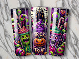 Three Halloween-themed tumblers with spooky characters and candy designs.