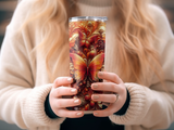 Fitted tumbler with ornate golden and red butterfly design.