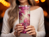 Woman holding a pink butterfly patterned tumbler with intricate floral details.