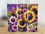 Three tumblers featuring vibrant sunflowers and floral designs on a wooden surface.
