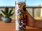 Tumbler with sunflowers, stripes, and the word "FREE" held by a hand.