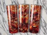 Three glittery tumblers with ornate, fiery butterfly and floral designs.