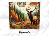 Elk standing in a forest during autumn with "Hunting Season" text.