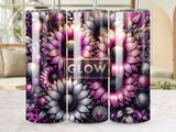 Three tumblers with floral designs and the word "GLOW" on a marble surface.