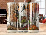 Deer silhouette in autumnal forest with "Hunting Season" text.