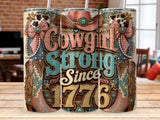 Cowgirl Strong Since 1776 tumbler with cowboy hat and boots graphics.