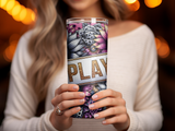 Tumbler with floral design and the word "PLAY" in glitter letters.