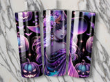 Three tumblers with Halloween witch and pumpkin designs on a marble background.