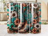 Turquoise cowboy boots with floral designs, set against a neutral background.