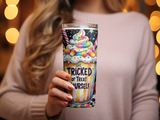 Woman holding a tall tumbler with "Get Tricked or Treat Yourself" text and candy.