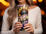 Woman holding a tumbler with sunflower, purple rose, and "GROW" text.