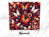 Ornate butterflies and floral patterns in warm, glowing colors on a dark background.