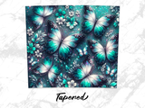 Teal and white butterflies and flowers on a textured background with "Tapered" text.