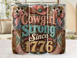 Cowgirl Strong Since 1776 tumbler with cowboy boots, hat, and bows.