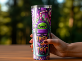 Purple tumbler with a cartoon monster and "Trick or Treat" text.