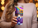 Corgi in witch hat and sunflower design on tumbler held by a person.