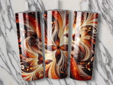 Three ornate tumblers with warm, swirling floral and butterfly patterns.