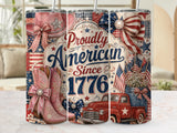 Pink cowboy boots, a vintage truck, and American flags on patterned tumblers.