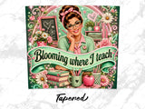 Woman with glasses and pinned hair, surrounded by books, flowers, and the phrase "Blooming where I teach."