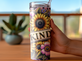 Sunflower and floral tumbler with "KIND" text, held by a hand.