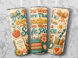 "You Were More Than a Teacher, a Safe Place" text on a tumbler design with books and flowers.