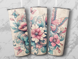 Three floral tumblers with butterflies and ornate designs.
