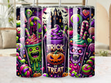 Three Halloween-themed tumblers with spooky drinks and candy designs.