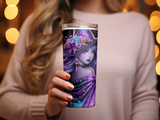 Woman holding purple witch tumbler with galaxy and floral design.