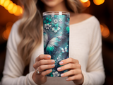 Woman holding a tall tumbler with a turquoise butterfly and floral design.