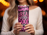 Woman holds a pink tumbler with "Summer Breaks Looks Good" text.