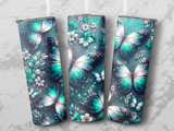 Turquoise butterflies and flowers pattern on a tumbler.
