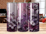 Floral and butterfly tumbler with purple, white, and silver accents.