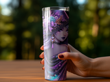 Purple witch tumbler with stars and floral accents held by a hand.