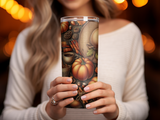 Tumbler with autumn motifs: pumpkins, pinecones, leaves, cinnamon sticks, and coffee.