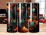 Tumbler with autumn leaves, pumpkin, and butterfly design.