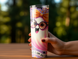 Tumbler with a cartoon ghost wearing oversized sunglasses and a bow.