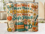 Teacher appreciation tumbler with books, apple, and motivational text.