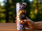 Hand holding a tall tumbler with a sunflower and floral design.