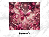 Pink glittery butterfly pattern with swirling decorative elements and text.