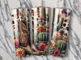 Cowboy boot, cacti, and butterflies on three tumblers against a marble background.
