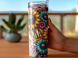 Tumbler with sunflowers, flowers, and text.