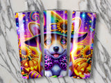 Corgi wearing witch hat and bow tie with pumpkins and sunflowers.