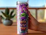 Halloween tumbler with cartoon monster and candy, reading "Trick or Treat".
