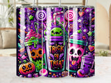 Three Halloween-themed tumblers with spooky cartoon characters and candy.