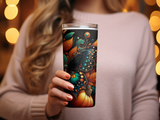 Tumbler with a butterfly and pumpkin fall design held by a person.