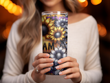 Tumbler with sunflowers, silver flowers, and checkered pattern, held by a woman.