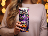 Halloween themed tumbler with pumpkin, castle, and treats.