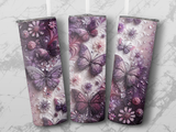 Three purple butterflies on floral patterned tumblers.