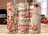Sunshine and lesson planning tumbler with iced coffee and school supplies.