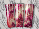 Three tumblers with pink floral and butterfly designs.